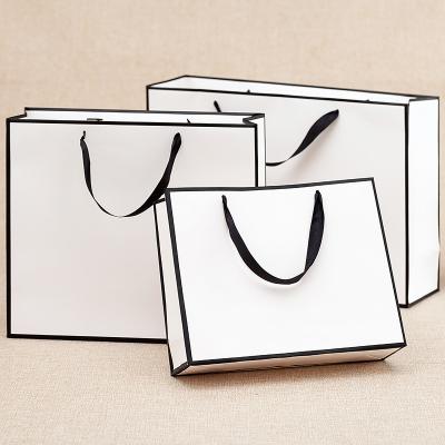 China Recycled Materials Luxury Gift Paper Bag Customized Retail Logo With Your Own Logo for sale