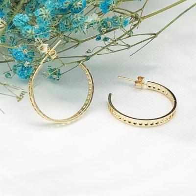 China High Shiny Polished Eco-friendly Gold Plated Hollow Shape Fancy Earrings For Women Big Circle Cc Earrings for sale