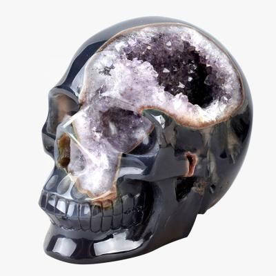 China Europe Ore Natural Semi Precious Stone Hand Carved Realistic Agate Amethyst Geode Crystal Skull for sale