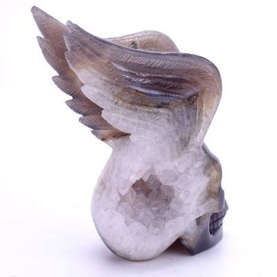 China Europe Wholesale Natural Hand Carved Exquisite Winged Crystal Skull With Wing for sale