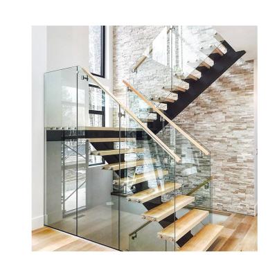 China Guangdong Stringer Round Glass Curved Stair Case Invisible Staircase Modern Step Design Balustrade Staircase for sale