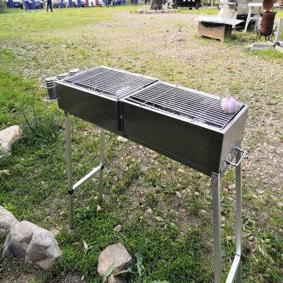 China Portable Adjustable Height Stainless Steel Charcoal Roaster Grill Pork Roaster Parrillas BBQ Grill for sale