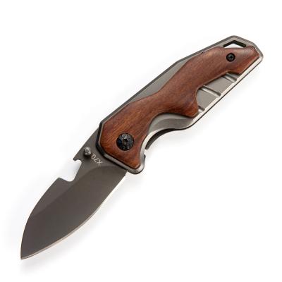 China Non-variable titanium pocket knife ebony wood handle folding knife frame lock camping knife with bottle opener small size self-defense rescue for sale