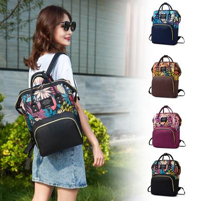 China Anti Theft Foil Printing Backpack Bag Anti Theft Multifunctional Lightweight Lightweight Thin Diaper Bag Fancy Running Bag Wholesale Anti Theft Diaper Bag for sale