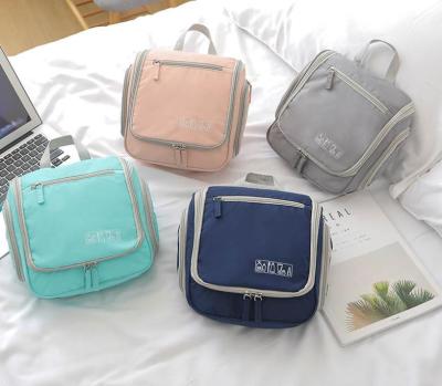 China Personalized Washable Waterproof Polyester Oxford Travel Easy Care Cosmetic Bags for sale