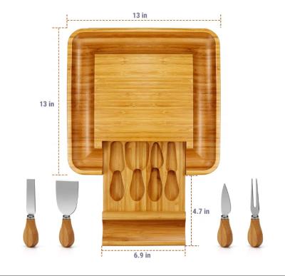 China Sustainable Bamboo Cheese Cutting Board And Knife Set Bamboo Cheese Board With Slide-out Drawer for sale