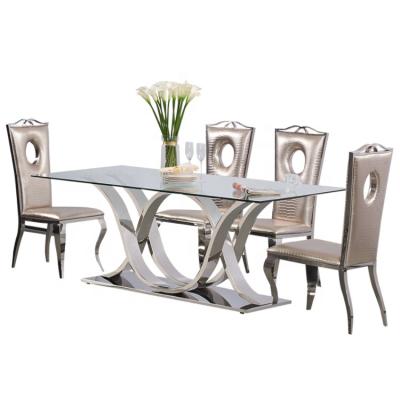 China Modern Hot Sale Foshan Glass Dining Table Set Stainless Steel Cheap Banquet Wedding Modern Dining Tables for sale