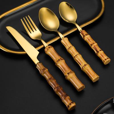 China Sustainable Gold Spoon Fork Set Silverware Flatware Wholesale Real Bamboo Handle Cutlery Set Stainless Steel for sale