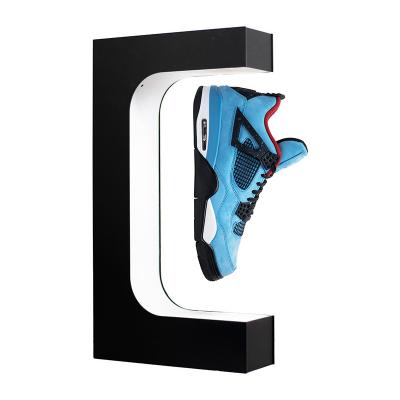 China Custom Acrylic Magnetic Levitation Floating Shoes Sneaker Floating Display Rack For Wholesale for sale