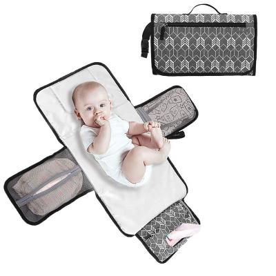 China Polyester Warm Portable Amazon Travel Change Mat Fish Bone Pattern Baby Diaper Changing Pad With Cloth Pocket And Head Pad for sale