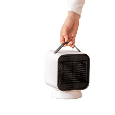 China Portable Household Fan Handle Desktop Anti-scalding Heating Radiator Rotating Warm Fan for sale