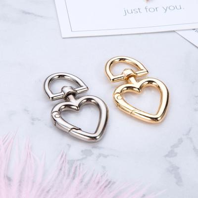 China Fashion Spring Clasp Heart Shaped Keychain Buckle Metal Spring Key Chain Bag Durable Electroplating Snap Hook for sale