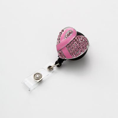 China Rotating Heart Shape Crystal Ribbon Breast Cancer Retractable ID Badge Reel for sale