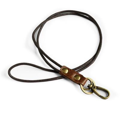 China Handmade Vintage Lanyard Keychain Metal Clip Car Holder DIY Genuine Leather Hand Strap Keychain for sale