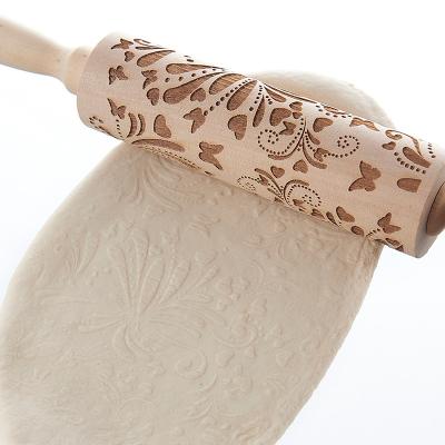 China Viable Exquisite Wooden Christmas Printing Rolling Pin Wooden Engraving Relief Rolling Pin for sale