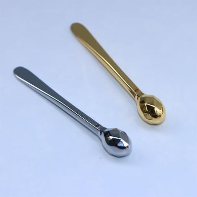 China Small Lift And Massage Make Up Spoon Metal Beauty Tools Face Mini Cosmetic Spatula for sale