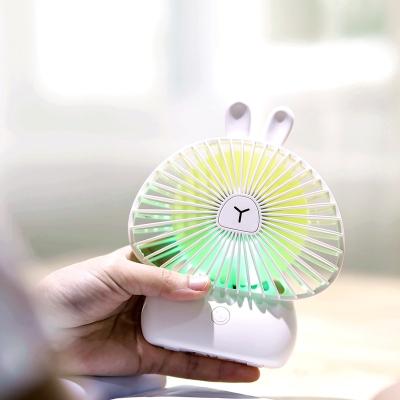 China Rabbit Shape Mini Hand Fan Electric Portable Air Vent Fan Cute Character With Light for sale