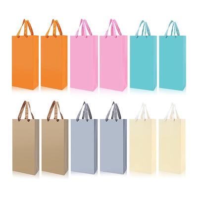 China Recycled Materials Waterproof High Quality Paper Wine Gift Bags Wholesale Cardboard Wine Packaging Bags With Handle for sale