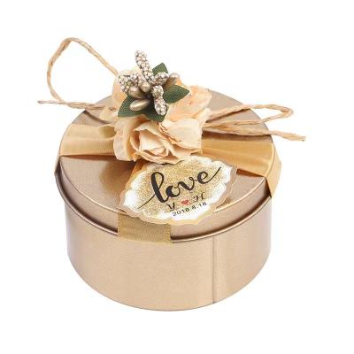 China Food Wedding Candy Tin Box With Lid Gold Round Shape Packaging Chocolate Gift With Flower Decoration for sale