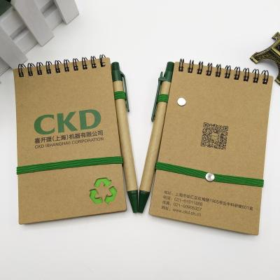 China Wholesale Printed Kraft Paper Pocket Spiral Notebook Elastic Printing Custom Journal With Pen for sale