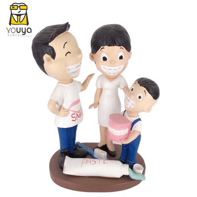 China Handmade Happy Family Resin Bracket Handmade Carved Dental Craft Sculpture for sale