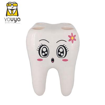 China Cartoon Viable Teeth Shape White Plastic Toothbrush Holder 4 Holes Toothbrush Holder For Kids for sale