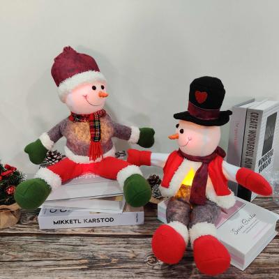 China Classic Adjustable Lighted Glowing Snowman Christmas Snowman Posture Snowman Doll LED Light With Tartan Hat for sale