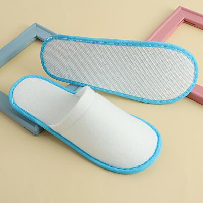 China Non-woven non-woven liner hotel spa hotel logo non-slip high-end nap custom fabric non-woven slippers disposable slippers for sale