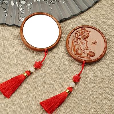 China Custom creative sandalwood MIN Portable Wooden Travel Mirror carved log makeup mirror customized for sale