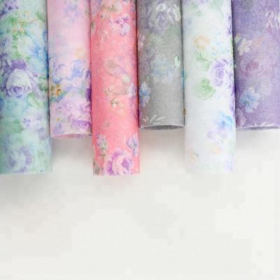 China Disposable Korean Style Long Fiber Polyester Nonwoven With Flower Bouquet Colorful Printing Wrapping Gift For Spring And Summer for sale