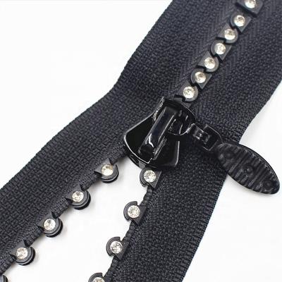 China Manufacturer Viable Clear Stone Diamond Decorative Plastic Zipper for sale