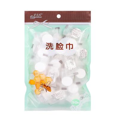 China Compressed Type 50 Candy Coin Cleaning Nonwovens Beauty Towels Flushable Compressed Towels Vacuum Packed Tablets for sale