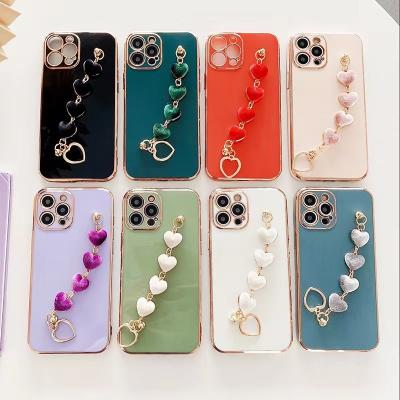 China Shockproof Luxury Multi Color Love Heart Wrist Bracelet Chain Phone Case For iPhone11 12 14 13 pro max for sale