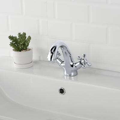 China Metered Faucets Deck Mounted Double Handle Bathroom Basin Hot Cold Water Mixer Taps for sale