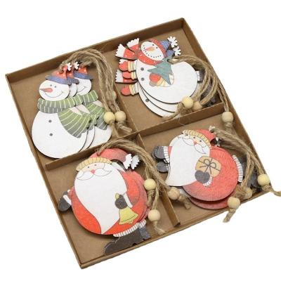 China Christmas Decoration 12pcs Set Decorated Pendants Handing Laser Cut Wooden Christmas Tree Ornament for sale