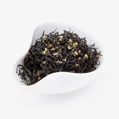 China Hot Water Brew Osmanthus Jiu Qu Whetstone Mei Blooming Tea Chinese Hand Made Tea Quantity Accpect Local OEM Small Bag Package for sale