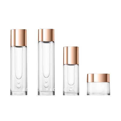 China Luxury Clear Glass Lotion Bottles Face Serum Perfume Pump Sprayer for sale