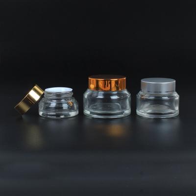 China Skin Care Selling Custom 30g Small Cosmetic Gold Cream Whole Lid And Silver Lid Around Clear Eye Cream Jar for sale