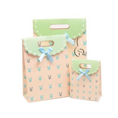 China 2022 New Sale Flip-Cover Small Cartoon Stickly Gift Bag Recyclable Hot Paper Tote Baby Gift Candy Gift Bag Custom Paper Bag for sale