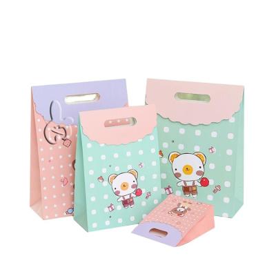 China 2022 Recyclable design for small lovely kids paper takeout bag custom high quality cheap cartoon gift candy paper bags for sale