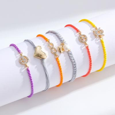 China Fashion Women Men Summer Handmade Braided Twisted Rope Bracelet Heart Color Luminous Bracelet Unisex Lead Free Nickel Free Charm for sale