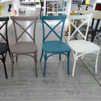 China Modern Hot Sale Stackable Metal Frame Stackable Restaurant Banquet Dining Cross Back Chair For Wedding for sale