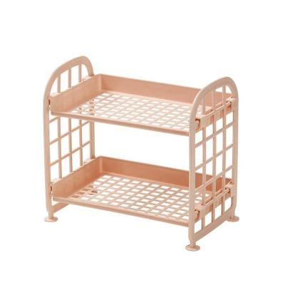 China Sustainable Bathroom 2 Tier Low Price Double Layer Cavity Plastic Desktop Cosmetics Shelf Finished Storage Rack for sale