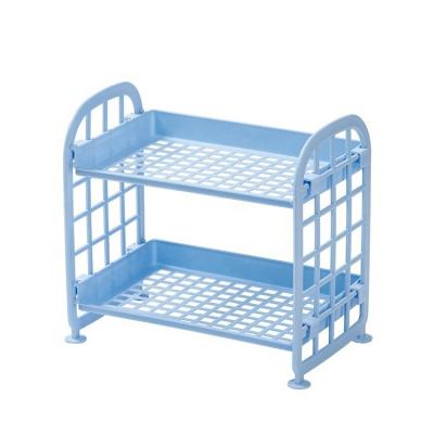 China Durable Plastic Hollow Cosmetic Shelf Doubles Storage Kitchen Shelf Low Price Bathroom Desktop Finished Rack for sale