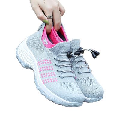 China Fashion trend ladies flight new knit breathable women casual shoes ladies shape to height increasing shoes lightweight socks sports shoes for sale