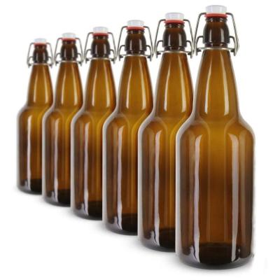 China Hotsale Eco-friendly 330ml 500ml 750ml 1000ml 16oz 32oz Amber Shakers Glass Beer Bottle With Swing Top for sale