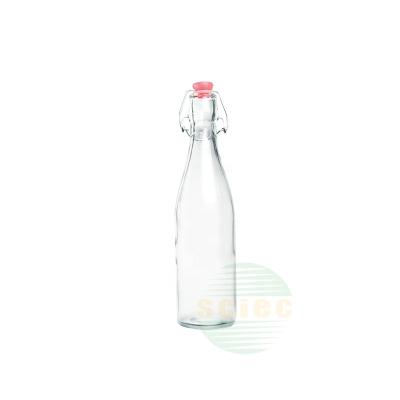 China Sustainable Reusable Glass Milk Container Bottle With Lid 520ml for sale