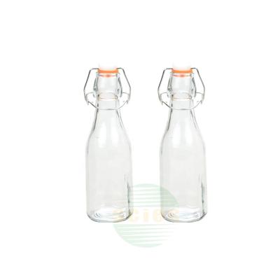 China Sustainable Reusable Glass Milk Container Bottle With Lid 250ml for sale