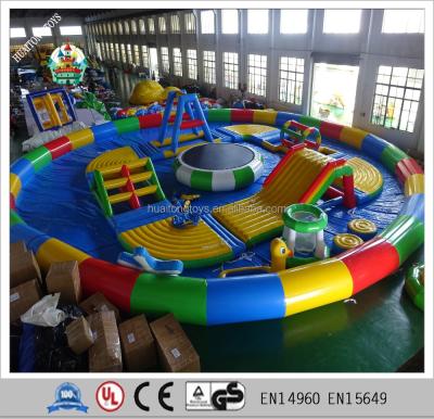 China Huaitong Outdoor Hot Sale Inflatable Playground Water Playground Park Slide With Pool On Land for sale