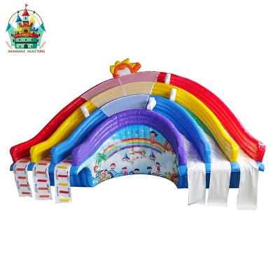 China Amusement park type new 2019 outdoor rainbow inflatable waterslide for kids land slide for sale